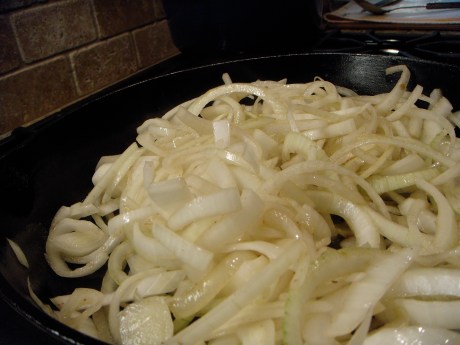 Sliced sweet onions caramelized in bacon fat.