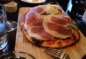 Proscuitto and greens pizza
